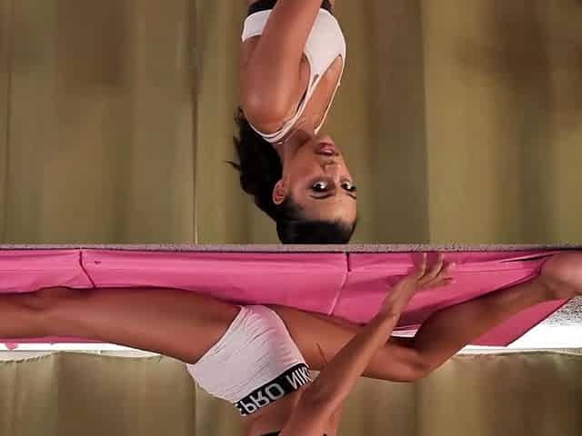 Natasha does yoga then fingers her wet pussy