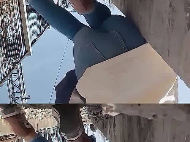 The very hopeless woman was pissing in her jeans beside the railroad tracks