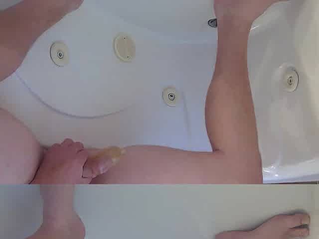 Pissing into a fuck-rubber in the bathtub