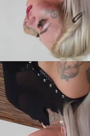 Tattooed blonde MILF combing her hair.