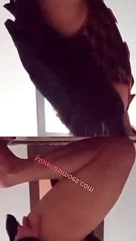 Brunette with a big butt in lingerie.