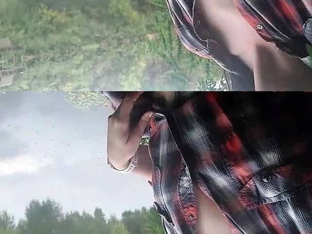 Brunette teen masturbates by the lake
