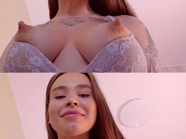 Breasty Amina licks and drools on her vertical pink teats