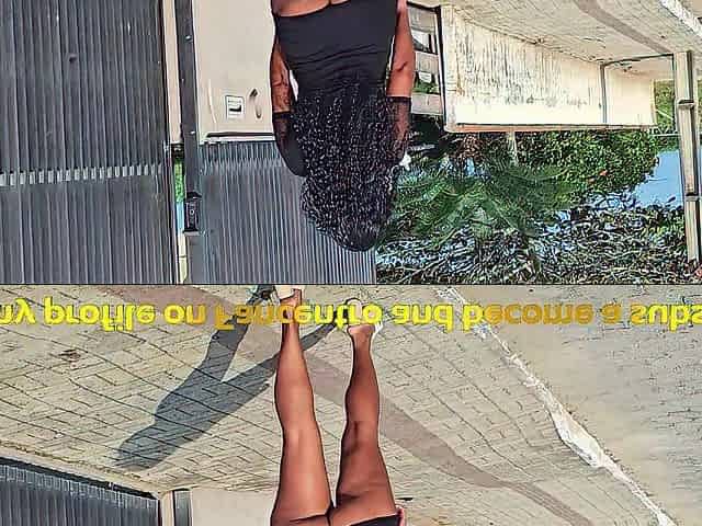SITTING WITH WIDEN LEGS ON THE STREET