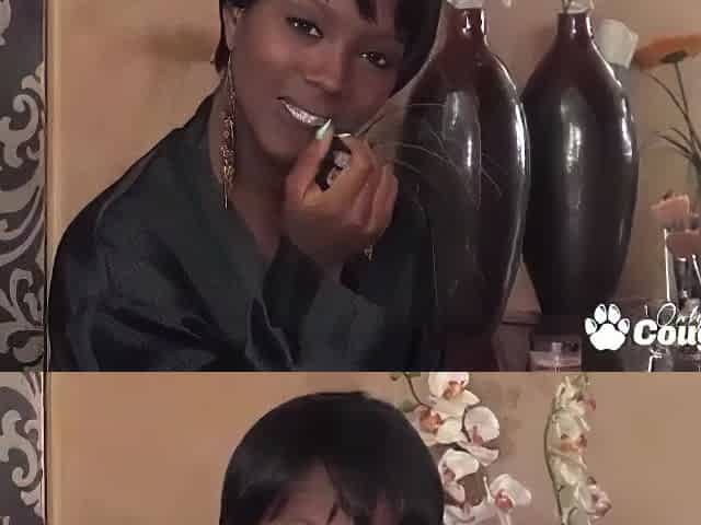 Black angel masturbating at cosmetic table