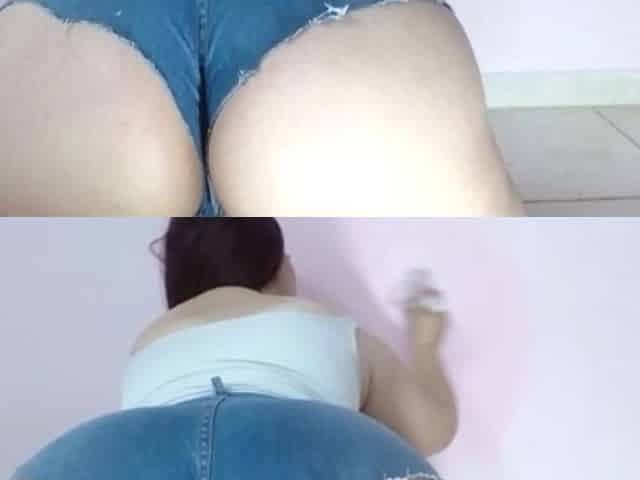 Latina with a Big Bum Paints the Wall in Front of the Camera