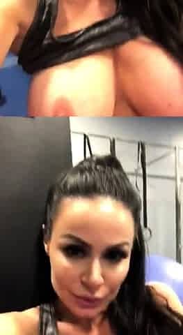 Busty babe playing with her big boobs