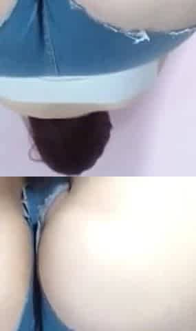 Latina with a Big Bum Paints the Wall in Front of the Camera