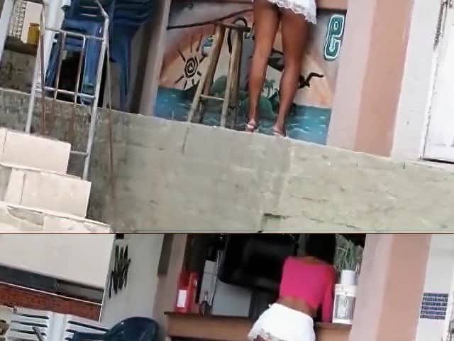Gorgeous Latina waitress is wearing a really short white skirt