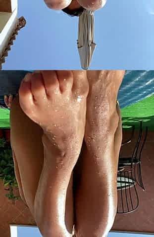 Brunette with foot fetish rubs big dick with her feet in POV