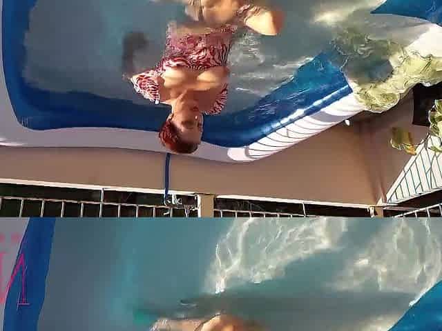 Elegant and supple honey, swimming underwater in the outdoor swimming pool. twenty one