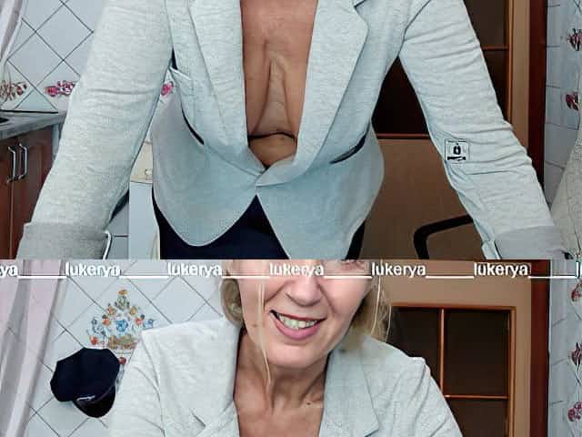 Lukerya tries on a jacket to a skirt, shows naked boobs