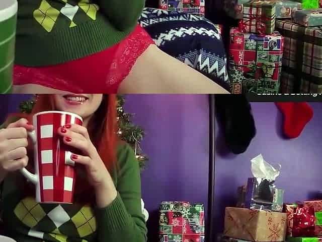 A redheaded milf with huge breasts celebrates Christmas in
