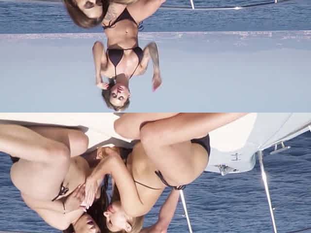 Alluring brunette explores passionate lesbian threesome with intense beach boat desire