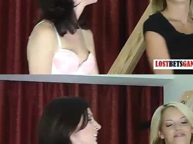 two pretty gals play a game of disrobe darts