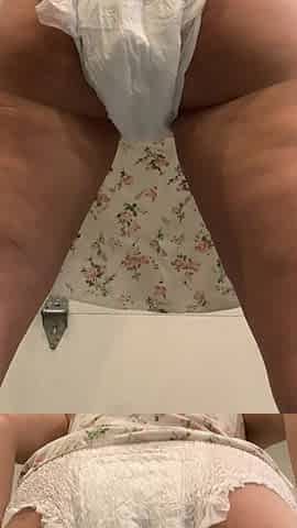 Up petticoat view of angel pissing in diaper