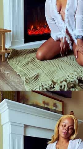 Horny girl masturbating by the fireplace