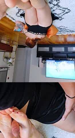 Petite redhead enjoys foot fetish session