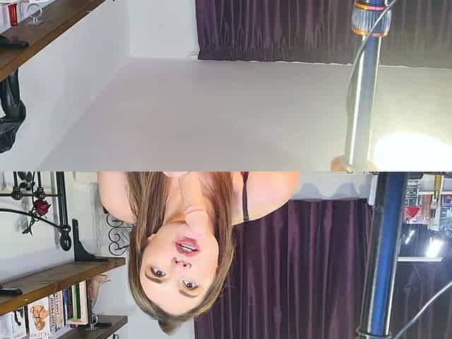 Redheaded pierced teen close up toy show