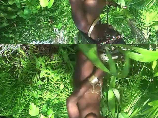 Slim village gal gathering plants in a jungle