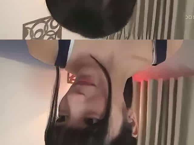 Her legs are spread and a vibrator is being inserted and removed while she is fingered.