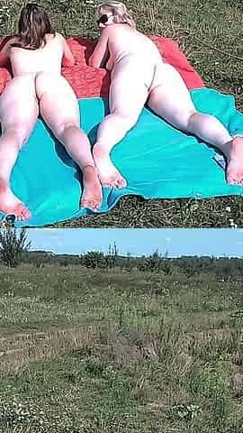 Mature MILF and Young Girl Sunbathing on a Wild Beach Without Clothes Naked Asses Big Tits Big Ass Natural Tits