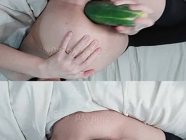 Slut sticking a cucumber in her holes