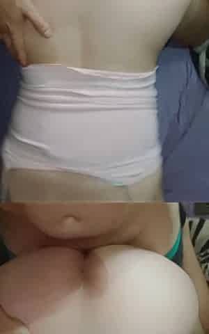 Homemade POV on the Mattress: My Girlfriend in a Pink Shirt and Cell Phone in Her Hand