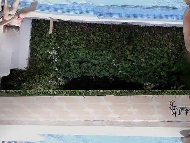 Having enjoyment in a pool of a swinger club!!