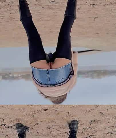Walking along the beach out of pants.