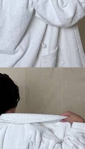 Mature Woman Takes off Her Clothes Except Her Bra in the Bathroom