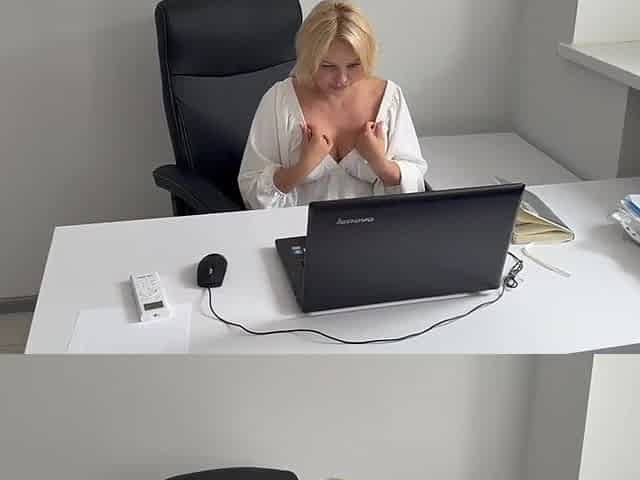 The office assistant chose to unwind after work hours by indulging in adult content at her desk.