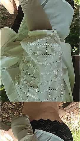 A aged woman walks throughout the forest in a sheer petticoat, showing off her large booty.