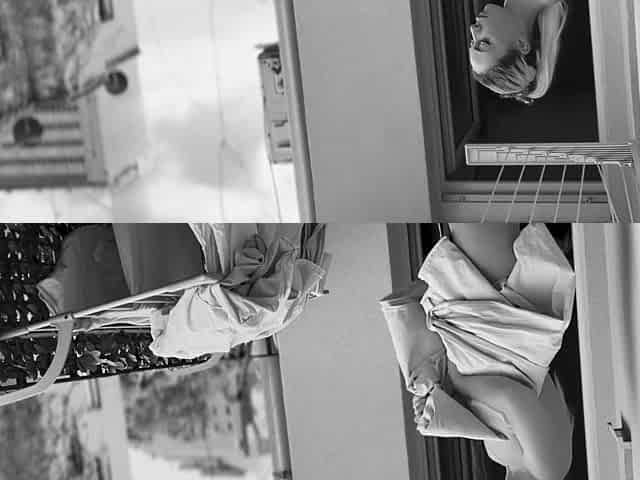 Naked chubby woman hangs out laundry on the balcony for