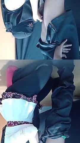 A Lonely Woman Wearing a Hijab in a Boarding