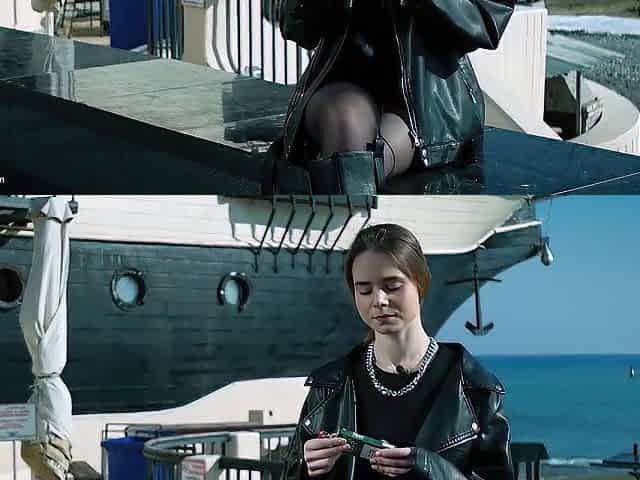 Youthful Russian Woman Smokin' Cigarette Outdoor Terrace