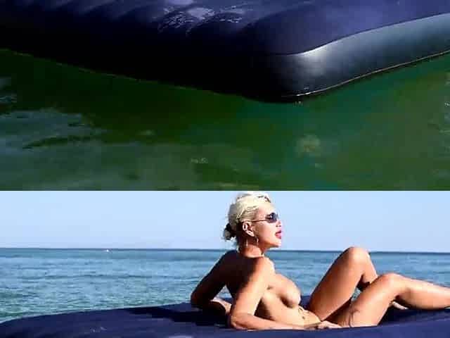 I spy on the beach as a cutie with large titties sunbathes in front of the public and dolphins