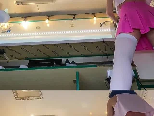 Sexy brunette hair honey singing and dancing with stripped booty at work