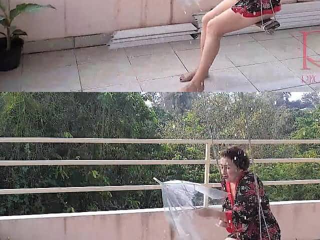 Dissolute housewife swinging out of pants, hiding from the rain beneath an umbrella. two