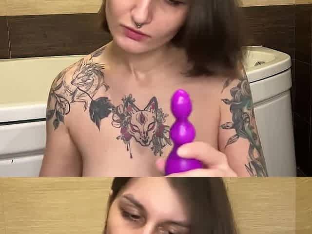 Whore bangs her butt with an Anal Toy