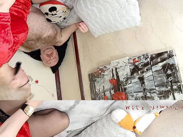 A Mature Lady in Red Sucks a Dick