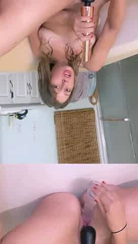 Horny hot blonde masturbates in the shower with a toy