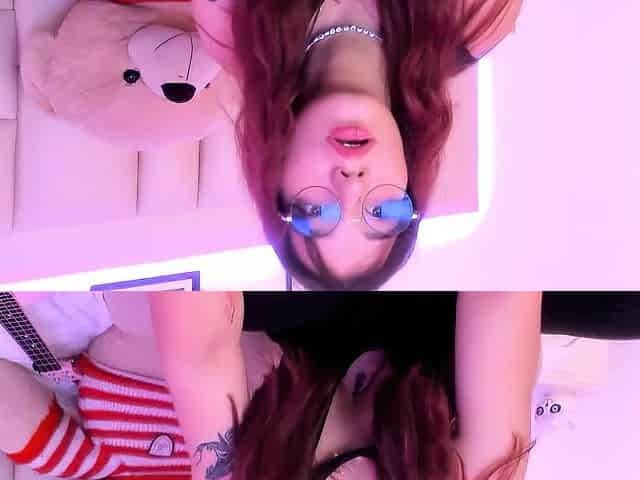 Nice-looking redhead beauty in glasses disrobes stripped and plays a ukulele for u