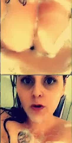 big beautiful woman large bazookas lathered up with soap in the shower