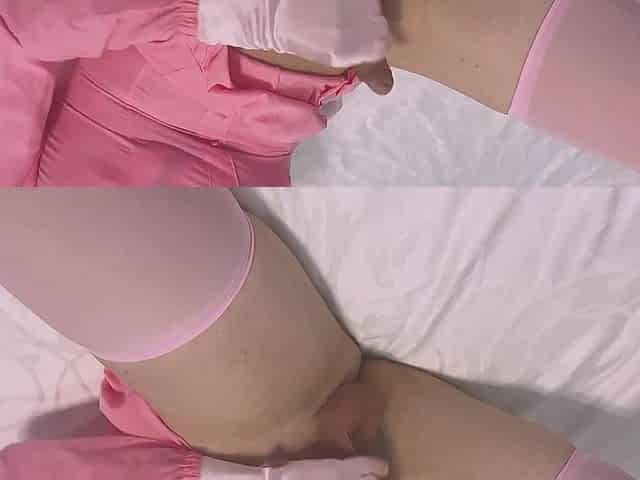 Sissy in pink playing with small chastity belt