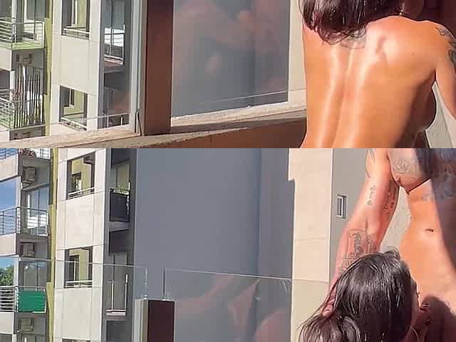 Sweaty brunette gets rammed on the balcony from behind