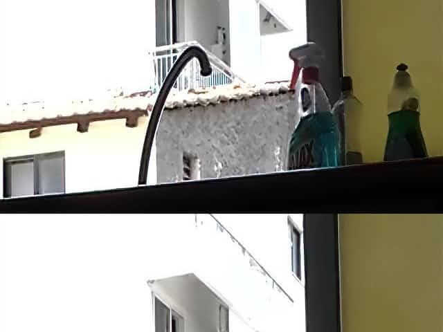 Sexy man smoking a cigarette and flashing his blonde neighbour
