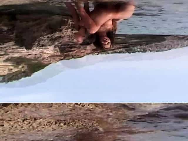 Wet lesbians making out on a public beach