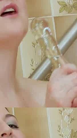 Girl Masturbates in the Bathtub with a Dildo in Doggy Style