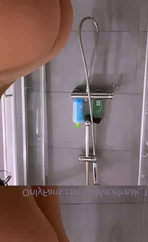Hot babe with perfect big boobs taking shower
